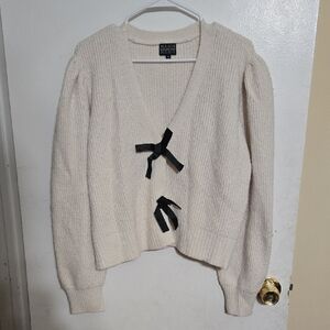 Cream Sweater with Black Bow Accents